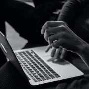 Hands on laptop engaged in online discussions. Credit Sergey Zolkin