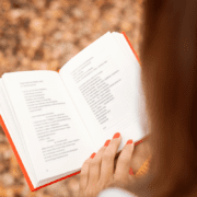 woman reading daily dedications book