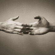 Two hands letting go