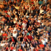 Blurred large group of spectators reflecting essential tips for working with large groups