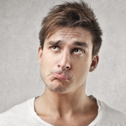 Man looking pensive wondering how long should a debrief be