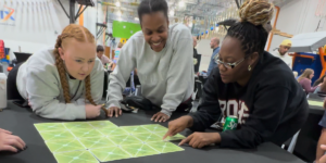 Women enjoying Connectiles team-building game for work