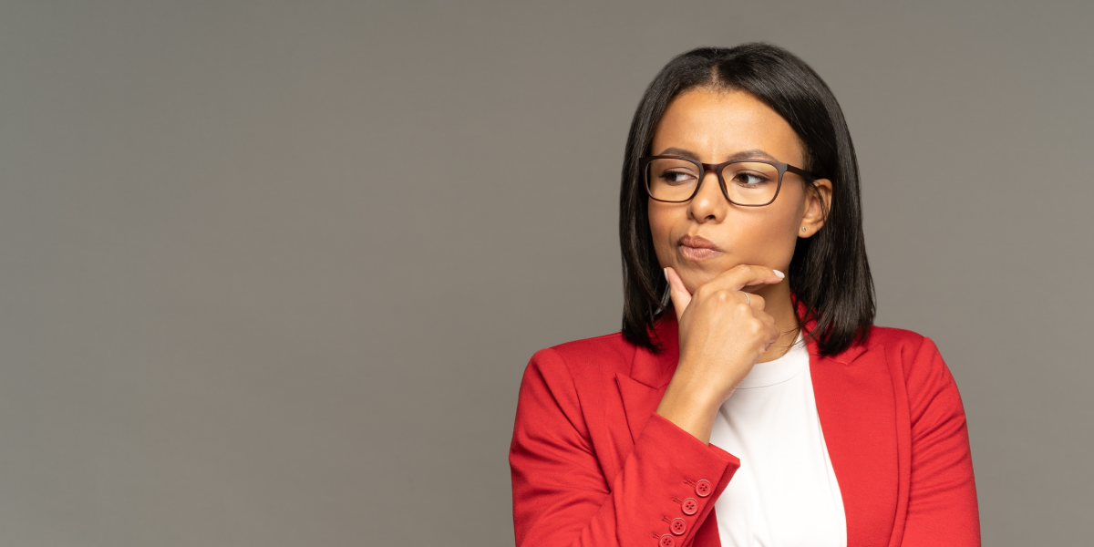 Woman thinking in red jacket
