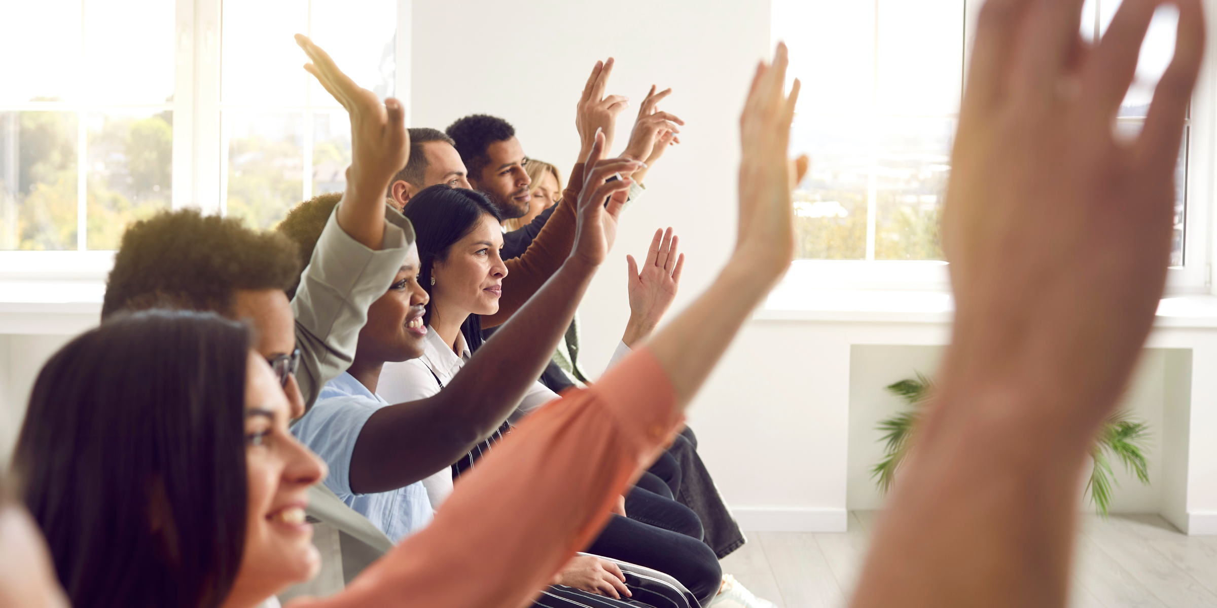 Group with Hands up showing why teams hold back